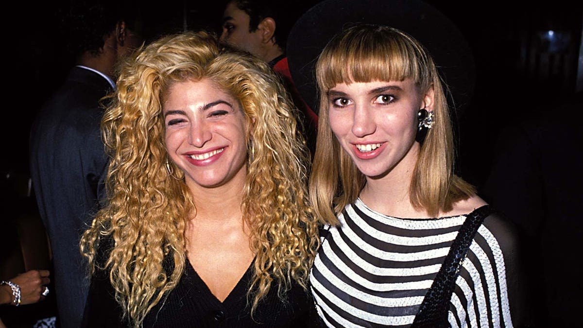 Taylor Dayne and Debbie Gibson stand together at the American Music Awards.