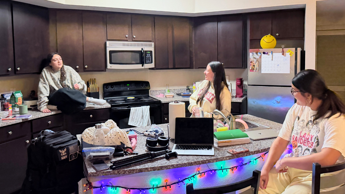 In their off-campus apartment, Texas Tech roommates Isabella, Kate and Candy gather around the kitchen island to discuss their differing political views and the issues shaping their votes ahead of the midterm elections in Lubbock, Texas, on Oct. 26, 2026.