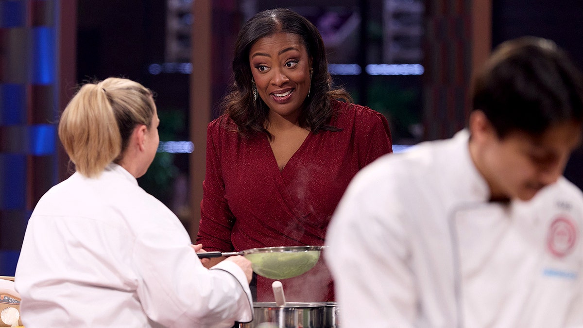 Tiffany Derry speaks to a contestant during an episode of "MasterChef."