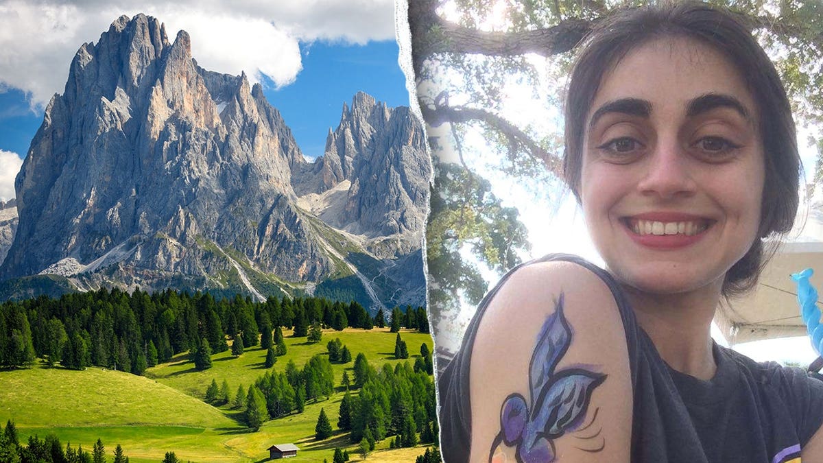 American female tourist and the mountains in the Dolomites, Italy