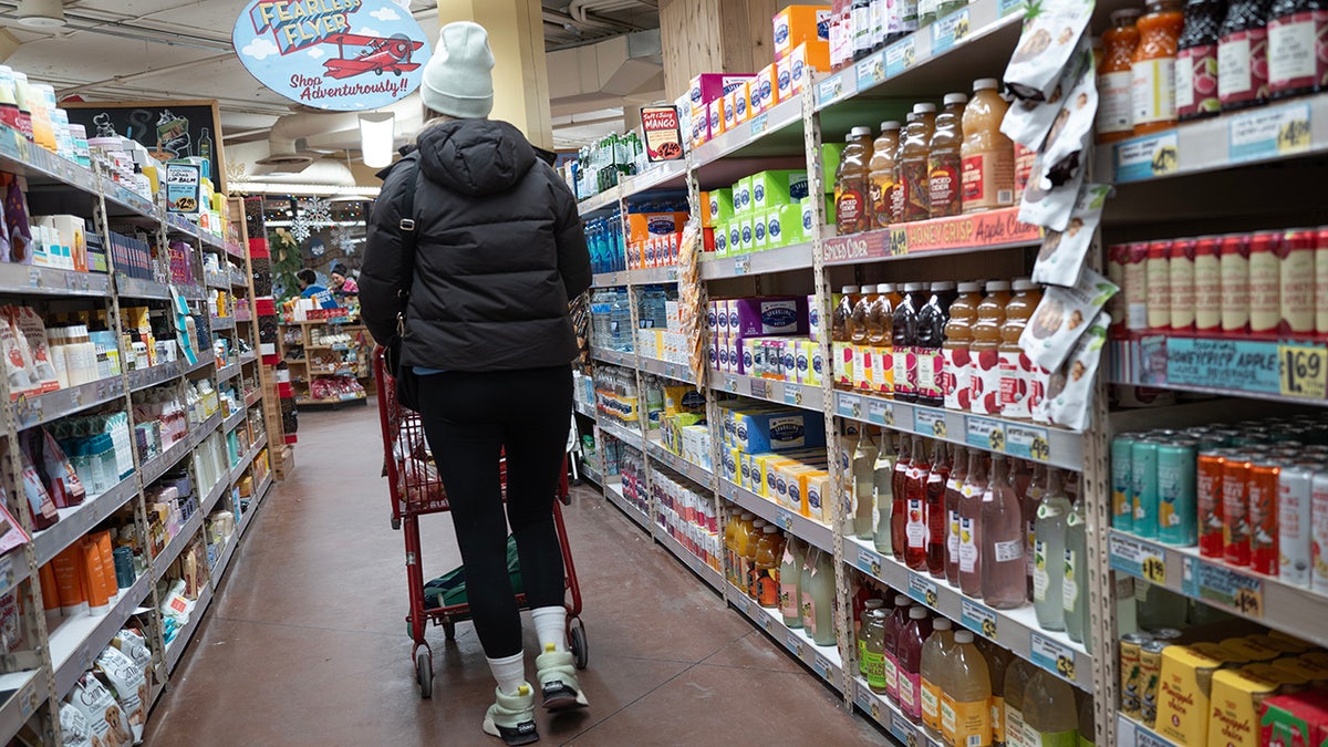 Female customer shops at a Trader Joe's store on December 10, 2025 in Chicago, Illinois.