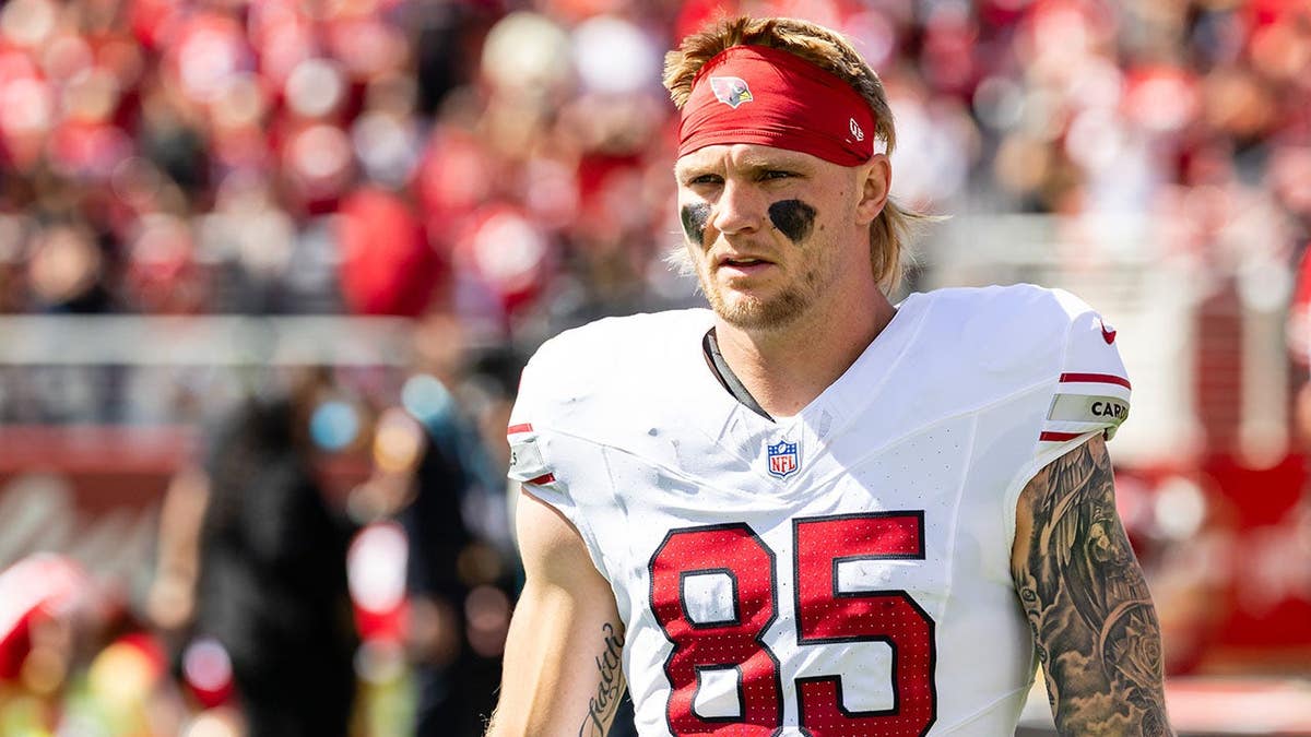 Trey McBride #85 of the Arizona Cardinals looks on before an NFL game.