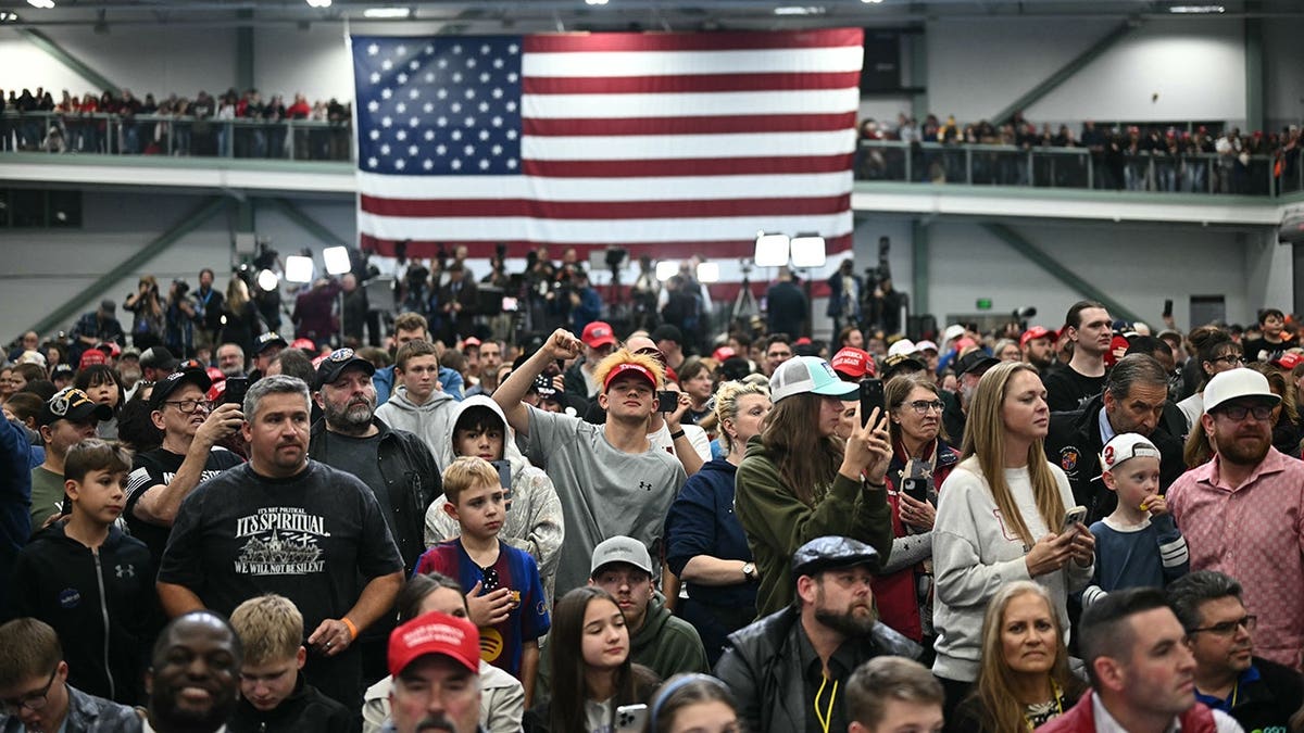 Supporters listen as Donald Trump speaks at a rally in Wasilla, Alaska.