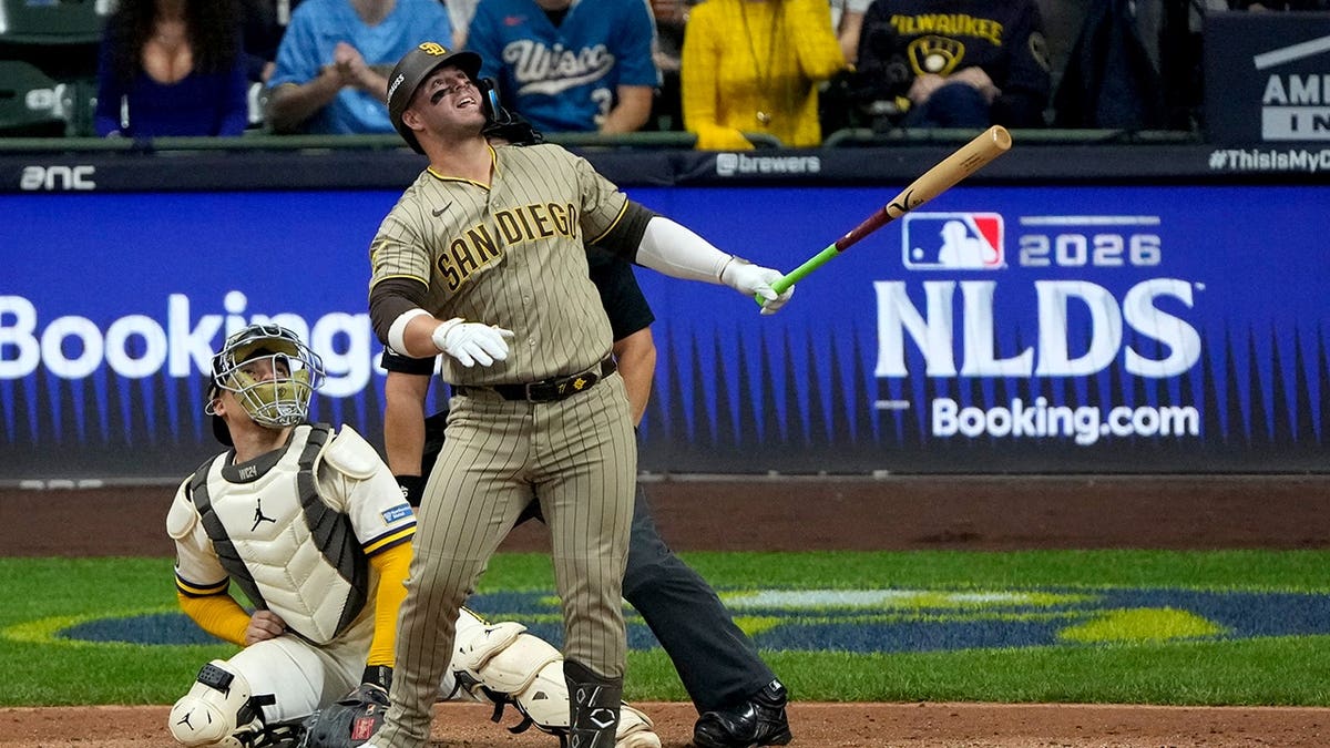 Ty France watches his ball hit a cable near the roof of American Family Field.