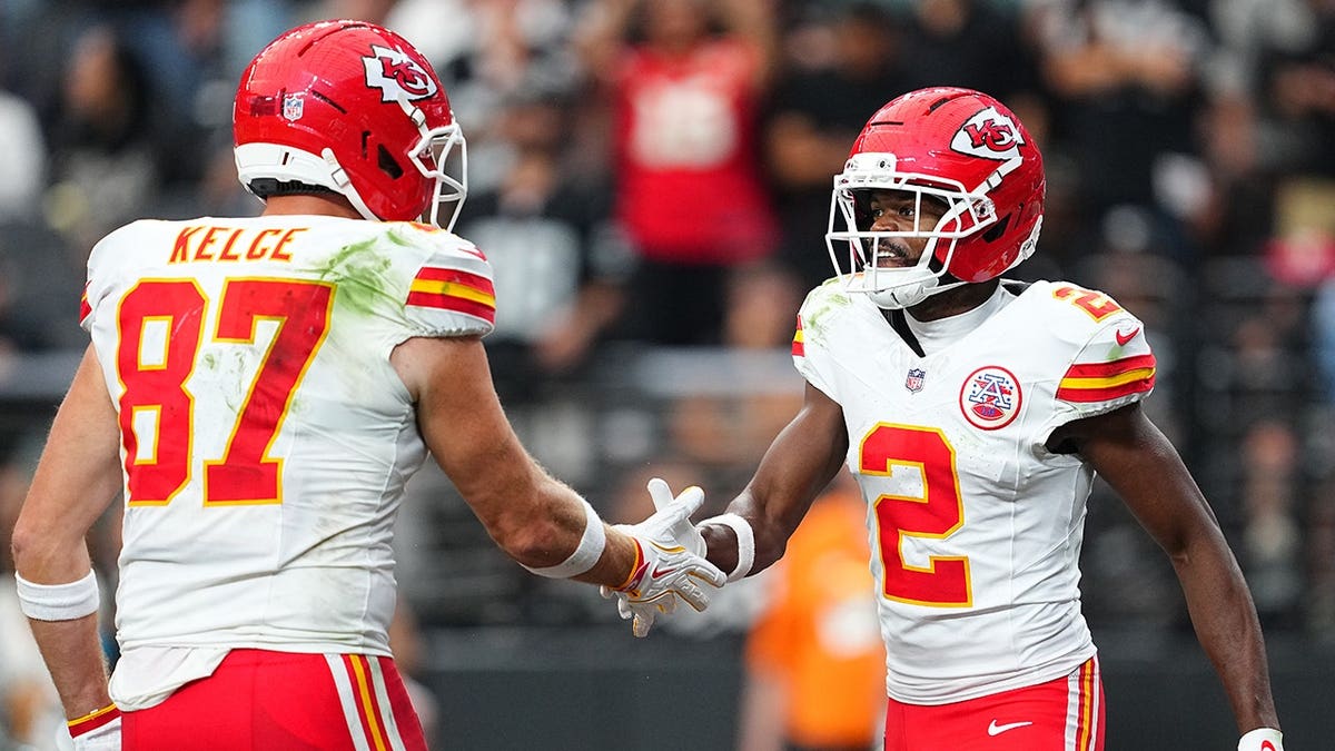 Tyquan Thornton celebrates with Travis Kelce after scoring a touchdown.