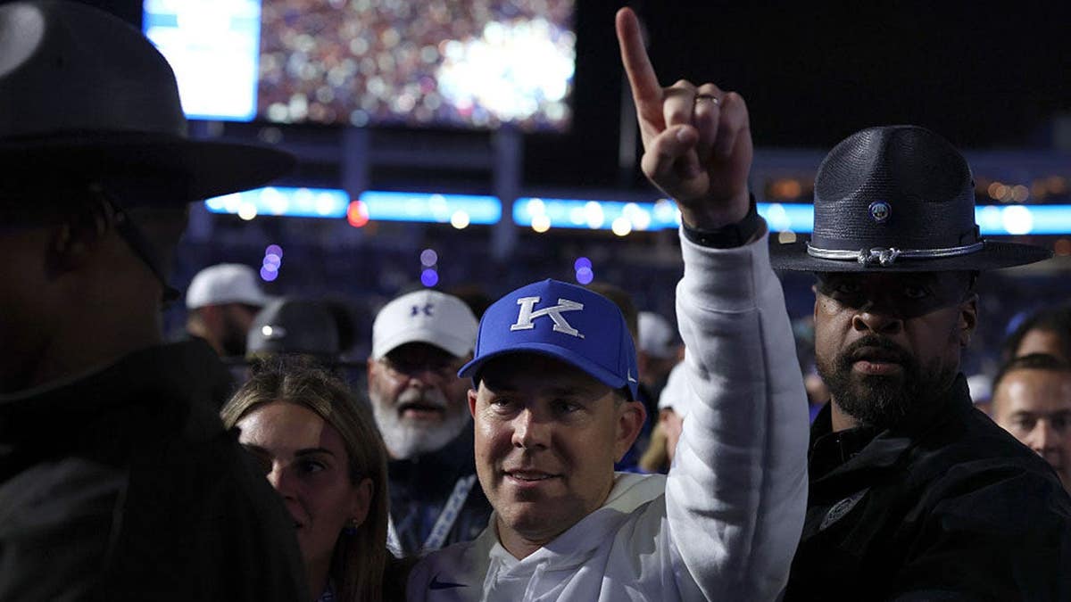 Will Stein celebrates after Kentucky's overtime win over LSU at Kroger Field.