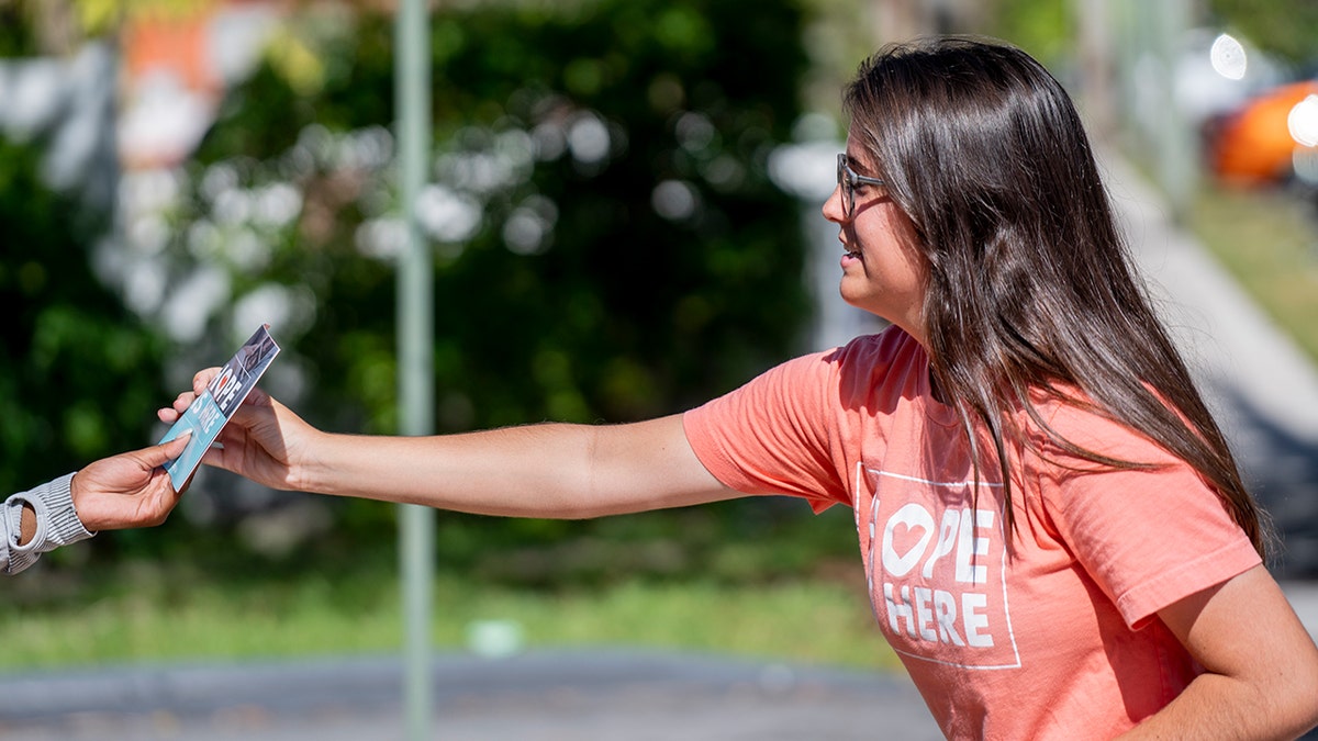 woman-hands-out-pro-life-literature