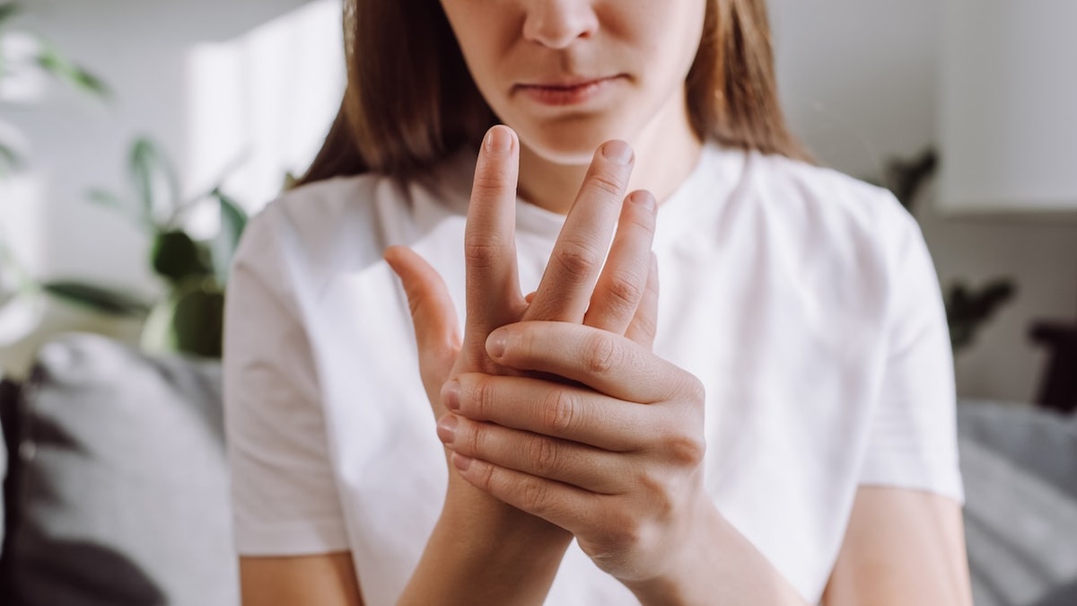 Woman with hand tremor