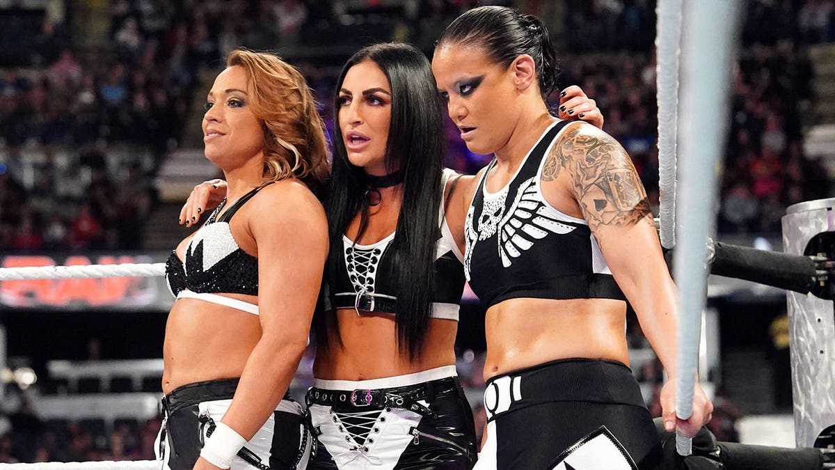 Zoey Stark, Sonya Deville and Shayna Baszler stand in the ring during Monday Night RAW.
