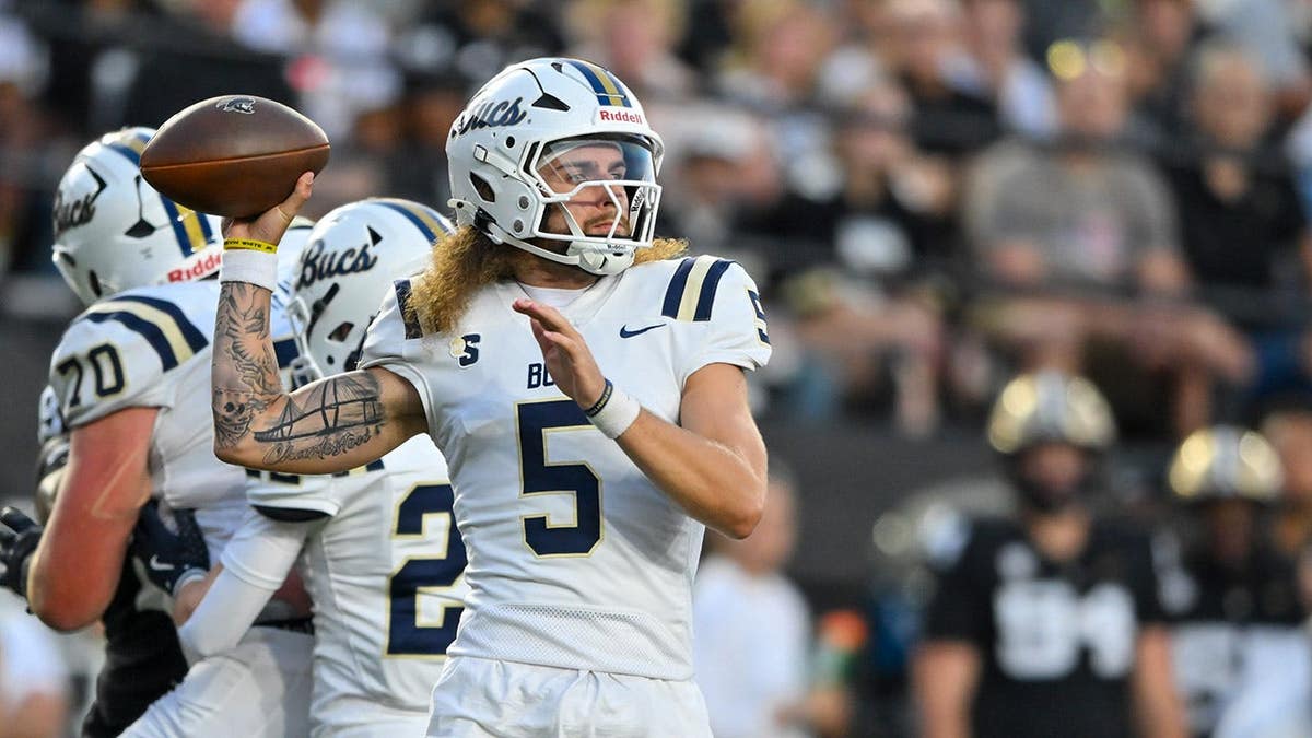 Zolten Osborne, Charleston Southern quarterback, looks to pass against Vanderbilt.