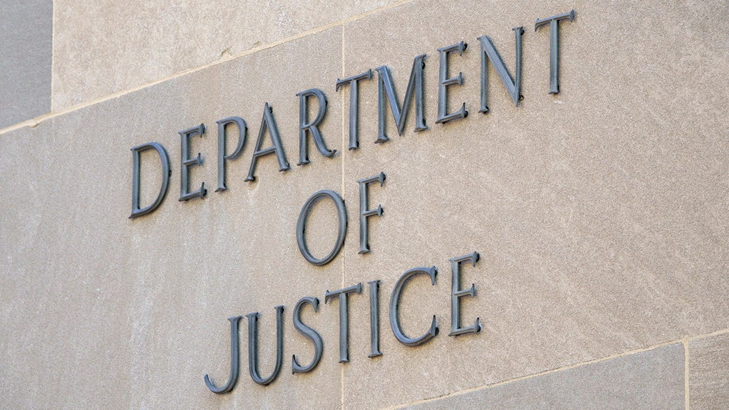 DOJ sign on the edifice of the building.