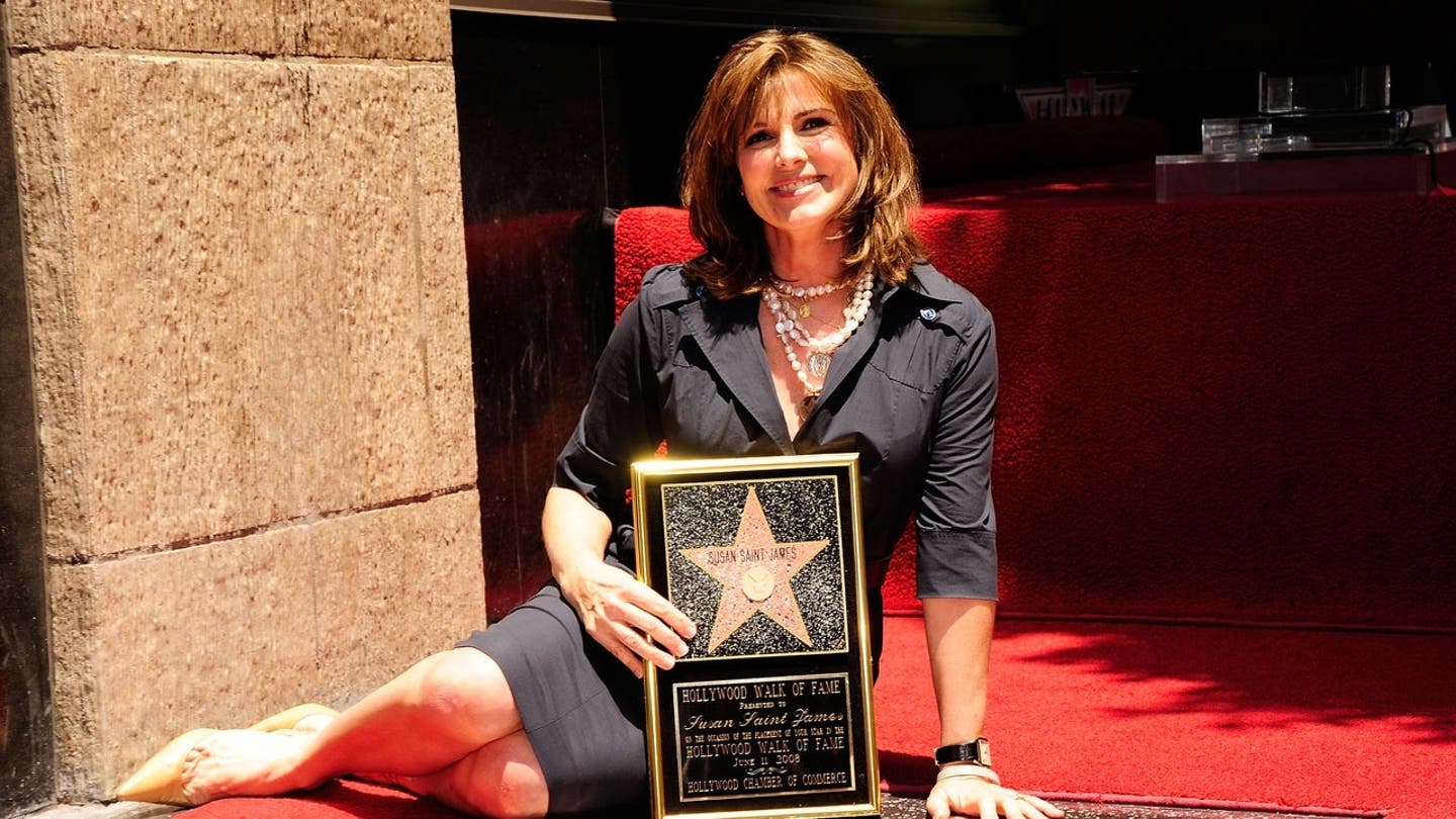 Susan Saint James poses while being honored with a star on the Hollywood Walk of Fame.