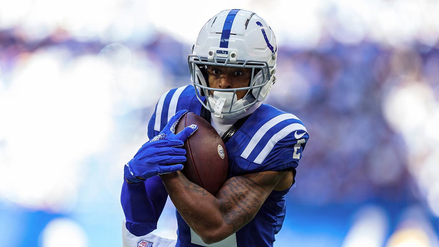 Josh Downs runs with the ball during NFL game action against the Tennessee Titans.