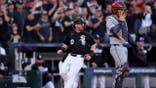 Chase Meidroth celebrates after scoring a run during a baseball game.