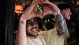 Eliya Cohen who was kidnapped during the deadly October 7, 2023, attack on Israel by Hamas, held in Gaza and released recently, gestures, as a crowd welcomes him