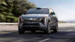 General Motors' Cadillac Escalade IQ drives down a road.