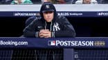 Aaron Judge watches from the dugout during Game 3 of the ALDS at Yankee Stadium.