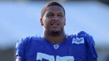 Alaric Jackson, No. 77, looks on during Los Angeles Rams training camp.
