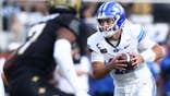 Bear Bachmeier #47 runs with the ball during a BYU Cougars game against UCF.