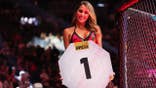 Brittney Palmer announces a round during a bantamweight fight at T-Mobile Arena.