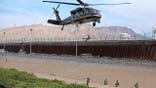 CBP Air and Marine Operations officers conduct a helicopter demonstration at the U.S.-Mexico border.