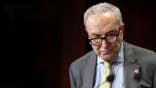 Chuck Schumer stands at a podium during a press conference at the U.S. Capitol.