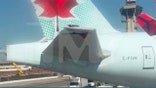 an Air Canada plane see after it was hit by a Delta plane.