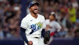 Freddy Peralta celebrates after the last out in the fifth inning.