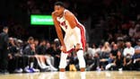 Giannis Antetokounmpo stands during a break in the game at Kaseya Center.