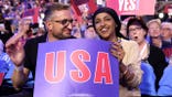 Tim Mynett and Ilhan Omar with USA sign