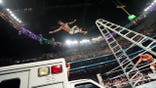 Je'Von Evans falls off a ladder onto an ambulance during a wrestling match.