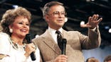 Jim and Tammy Faye Bakker speak to a television audience at PTL Ministry.