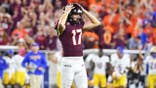 John Love reacts after missing a field goal at Lane Stadium.