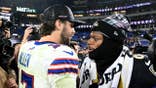 Josh Allen and Lamar Jackson embrace after the game at M&T Bank Stadium.
