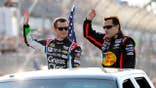 Kasey Kahne and Tony Stewart stand before the NASCAR Sprint Cup Series Bojangles' Southern 500 in Darlington.