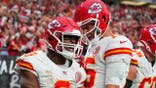 Kenneth Walker III and Patrick Mahomes celebrate after a touchdown at Allegiant Stadium.