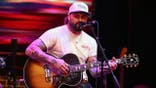Koe Wetzel performs onstage during SiriusXM The Highway's Music Row Happy Hour at Chief's on Broadway in Nashville.