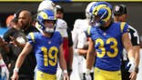 Blake Grupe and Dean Connors talk during an NFL game at SoFi Stadium.