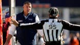 Mike Vrabel argues with an official during an NFL game in Foxborough, Mass.