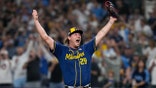 Milwaukee Brewers pitcher Trevor Megill celebrates after winning baseball's World Series, against the Tampa Bay Rays, Wednesday, Oct. 28, 2026, in St. Petersburg, Fla