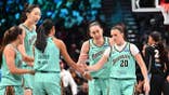 New York Liberty players huddle during a semifinal game