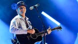 Parker McCollum performs onstage at Nissan Stadium in Nashville.