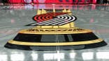 NBA Cup logo painted on court during Sacramento Kings vs. Portland Trail Blazers game.