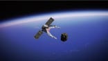 A claw grabbing a satellite
