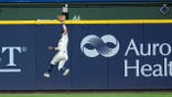 Sal Frelick catches a fly ball during Game 2 of the National League Championship Series.
