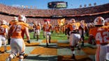 Tennessee Volunteers take the field at Neyland Stadium before their game against Alabama.