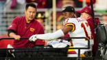 Terry McLaurin is carted off the field at Levi's Stadium.