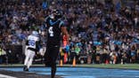 Tetairoa McMillan celebrates a touchdown at Bank of America Stadium.