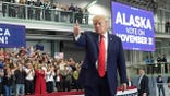President Donald Trump gestures at a campaign rally in Alaska