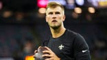 Tyler Shough warms up before an NFL game at Caesars Superdome in New Orleans.